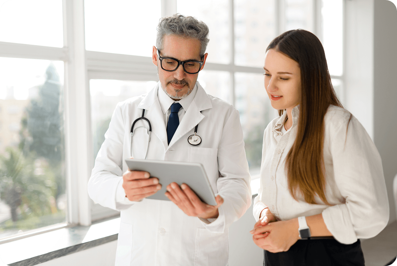 Doctor and patient discussing medical results together.